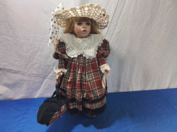 A Lovely Medium Doll with Ceramic Face, her name is 