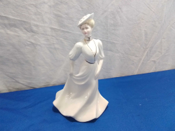 A Coalport Figurine in the Lady of Fashion Series 'Louise' W.12 H.20 Cm.