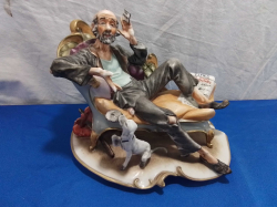 A Capotimonte Porcelain Figurine.W.16 H.18 Cm.