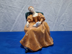 An Early Royal Doulton figure of a Seated Lady 