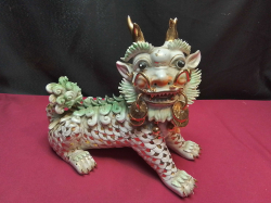 A massive Chinese Gaudian dog very ornate gold markings. W.28 H.22 Cm.
