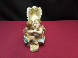 A vintage German hard paste porcelain ladies shoe with two kissing cherubs (5 inches high x 6 inches wide) in perfect condition - marked underneath
