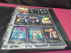 A binder with 100 vintage BEATLES TRADING CARDS in plastic folders