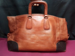 A Large Brown Leather Travelling  Bag.
