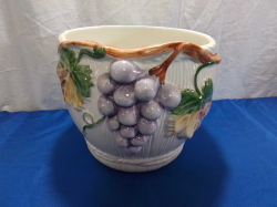 A Pottery Jardiniere with Embosed Grapes. H.23 H.19 Cm.