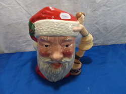 A Large Royal Doulton Santa Claus Charecter Jug with Young girl Handle. W.18 H.20 Cm.