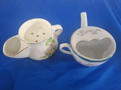 A Babies Feeder and a Shaving mug