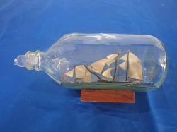 A Ship in a glass blottle. W 9cm L.26 cm
