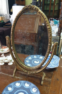A beautiful English Rococo style gilt wood mirror. W.36 H.51 Cm.