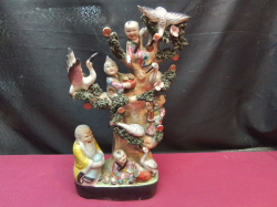 Porcelain Chinese Figurine Depicting Monks with Children in Prosperity Tree. W.15 H.35 Cm. 