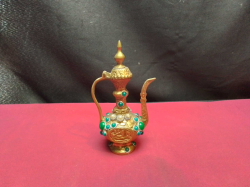 A small decorative Turkish coffee pot. W.7 H.13 Cm.