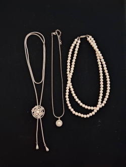 3 different vintage-style faux pearl necklaces. 
