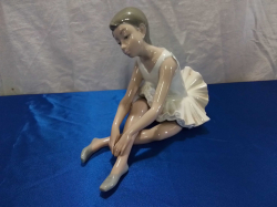 A Lovely NAO Ballerina Seated. L.20 H.13 Cm.