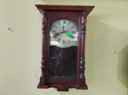 A Small 31 Day Mahogany Wall Clock . D.16 W.28 H.54 Cm.