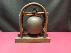 A Lovely Wooden Frame Containing a Temple Bell. W.20 H.21 Cm.