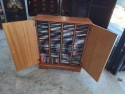 Cupboard with 160 CDs of Old Song. W.64 D.20 H.75 Cm.