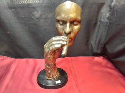 A Heavy Metal of Man's Face Smoking a Cigar on A Hand Mounted Sculpture. W.20 H.38 Cm.
