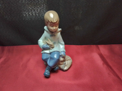 A vintage 1987 LLADRO NAO porcelain figurine of a ''BOY WITH BUNNY RABBIT