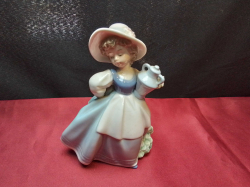 A vintage 1985 LLADRO NAO 'Country Maiden' #493 (Young Girl With Water Jug) porcelain figurine. Height 16cm.