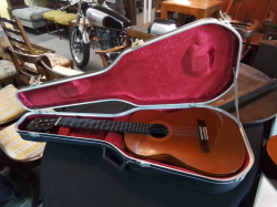 A rare Petersen 1980 high quality Model C Concert Guitar. Top: Spruce. Sides and back: Rosewood. Fretboard: Ebony. The label is signed 