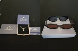 Beautiful ladies necklace with original box and 2 pairs of ladies sunglasses. 1× black and 1× brown.