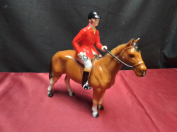  A porcelain fox hunter on horse. Height 20cm. No damage.