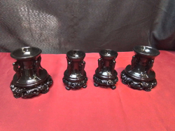 4 Chinese Black Resin Candle stick holder. Marked at base. 