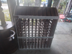 A Large 120 Bottle Wooden Wine Rack. W.107 D.34 H.140 Cm,