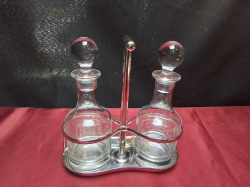 A Silver Plated Stand with Glass Oil and Vinigar Fruets.