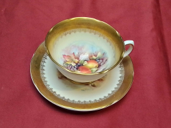 A Royal Grafton Hand Painted and Signed D Wallace Cup and Sauser.