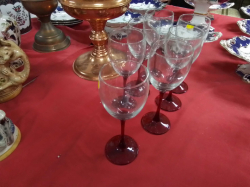 A Set of 7 Wine Glasses with Red Stamped and Bases.