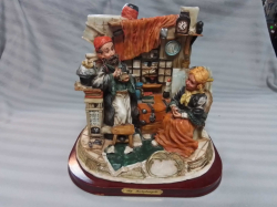 A Large Figure Group by Michael Angelo. W.25 H.26 Cm.