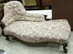 An English Regency C,1830 Rosewood chaise longue with hand- carved roses decoration standing on cabriole legs with  the original brass casters. A really elegant beautiful piece of furniture? W.76  L.170 H.90 Cm.