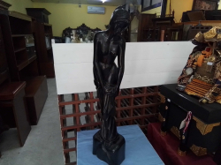 A heavy carved wood standing naked lady. H.79 Cm.