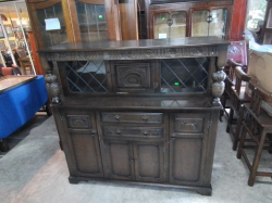A Lovely Oak Court Cupboard with Leaded Glass Doors an Carven Supports in Ercol Style(99) W.140 D.47 H.138 Cm.