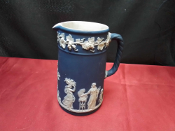 An Old Wedgwood Dark Blue Jasperware Jug. W.9 H.16 Cm.