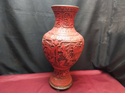 An Antique Chinese red carved cinnabar lacquer vase on stand. W.24 H.51 Cm. 