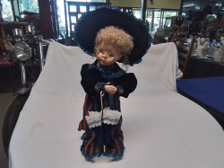 A Lovely Doll with A Base Holding Umbrella. W.14 H.41 Cm.