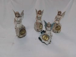 A Set of 4 Resin Fairy Figures with Solarcell Lights.