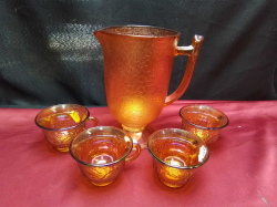 A Large Carival Glass Jug and 4 Cups.