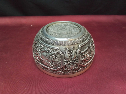 An antique carved Chinese silver bowl (stamped) W.12 H.6 Cm.