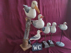 A Lovely set of 6 wooden Carved sea gulls on a Mooring foot with a rope and Anchor.