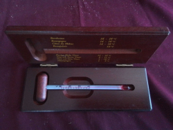 A wine Temperature in Wooden  case 