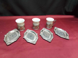 3 Silver plate cup holders with cups and silver plate coasters 