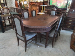 A Lovely Hand Carved Teak Dining table L.200 W.110 Cm.H.70  and 6 chairs Nicely Upholstered in grey. 
