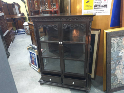 An old antique Thai freeware two-door display cabinet with 2drawers with original gooseberry Thai fruit porcelain handles. Sold as seen. W.89 D.36 H.120 Cm.