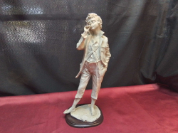 A Large Figure of A Boy Smoking a Cigarette. W.12 H.37 Cm.
