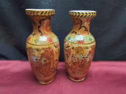 A pair of oriental vases hand painted. W.8 H.20 Cm.