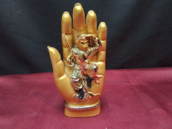A unusual Chinese statue of a hand with a monkey king figure in the palm. W.8 H.16 Cm.  