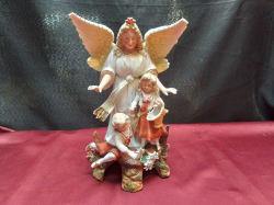 An Angle  German Figure with 2 Children. A/F W.15 H.25 Cm.